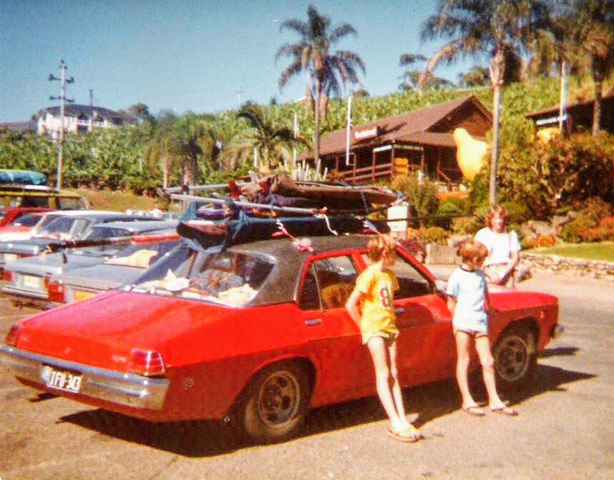 The HT Kingswood on another trip up to the Sunshine Coast. Here it is with sailboard gear on the roof outside the Big Banana